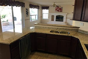 Giallo Ornamental Granite Kitchen with Fair Field Cabients